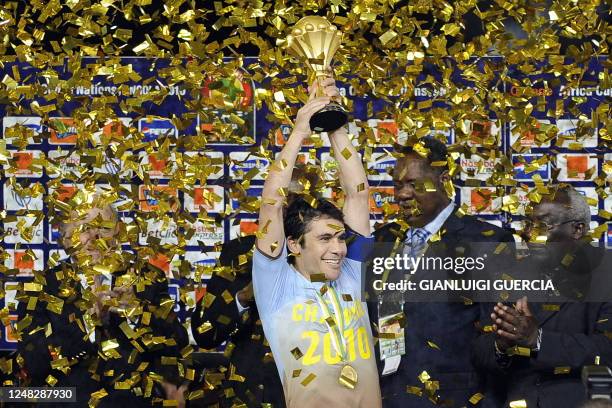 Kamel Ahmed Hassan Captain of Egypt's national football team reacts as he holds up the African Cup of Nations trophy after winning their final match...
