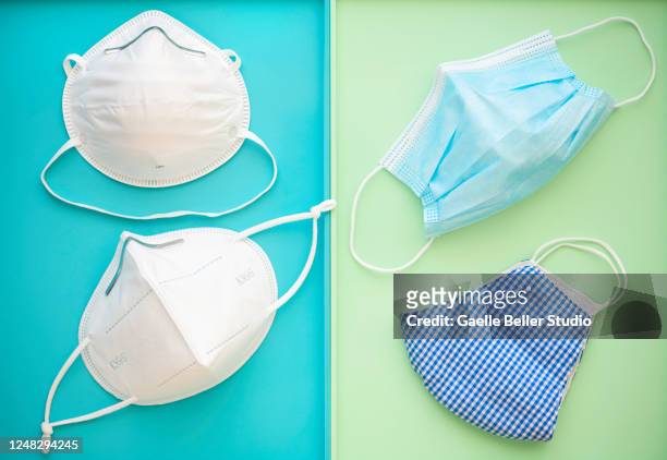 protective face masks commonly used during 2020 pandemic - mascarilla n95 fotografías e imágenes de stock
