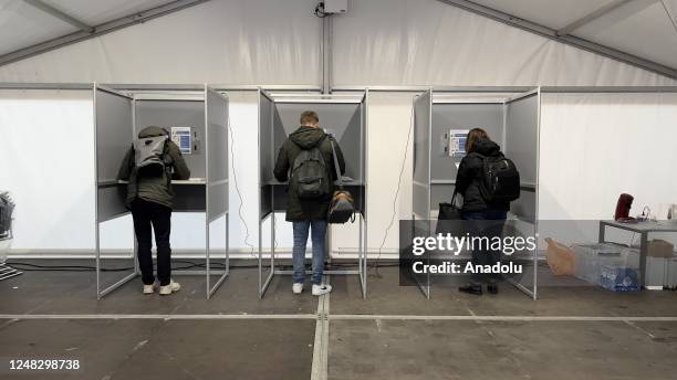 Citizens living in the Netherlands cast their votes at a polling station during the State Assembly elections in Schiedam, Netherlands on March 15,...