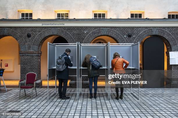 People vote in the Provincial Council and the general boards of the water boards elections at a polling station in The National Maritime Museum in...