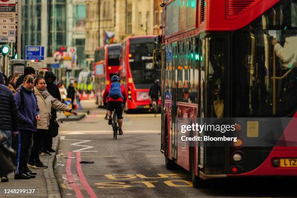 Commuters wait at bus stops near London Liverpool Street railway station during a strike by London Underground workers in London, UK, on Wednesday,...