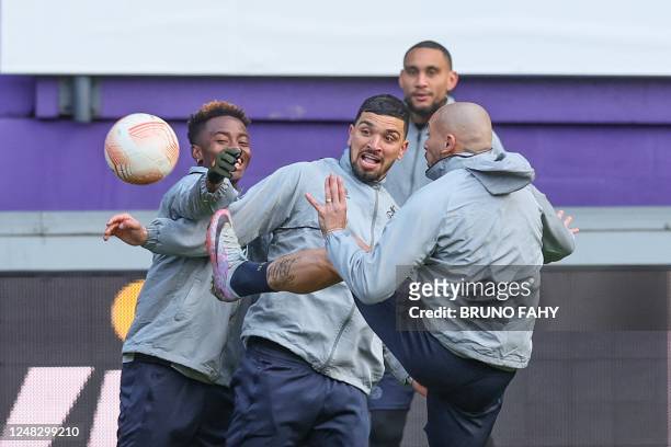 Union's Simon Adingra, Union's Cameron Puertas Castro and Union's Teddy Teuma fight for the ball during a training session of Belgian soccer team...