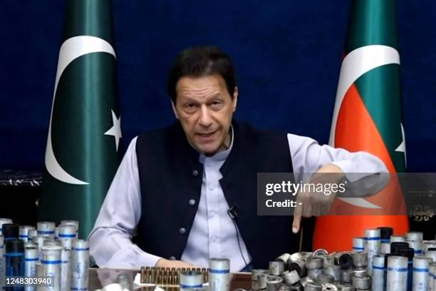 This screengrab from Pakistan Tehreek-e-Insaf via AFPTV taken on March 15, 2023 shows former Pakistan prime minister Imran Khan issuing a video...