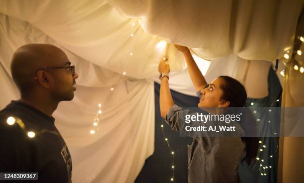 building a blanket fort inside home - fortress stock pictures, royalty-free photos & images
