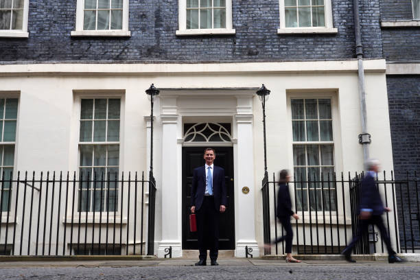 Chancellor Jeremy Hunt leaves Downing Street with the despatch box to present his spring budget to parliament on March 15, 2023 in London, England....