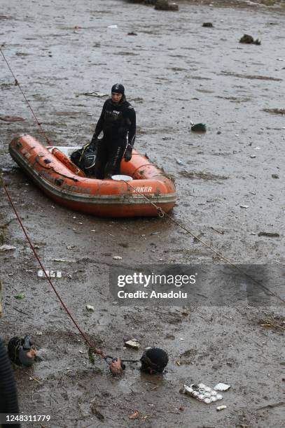 Police divers, also known as frogmen, of Turkish Police Department conduct search and rescue operations at the flooded crossroads after downpour hit...