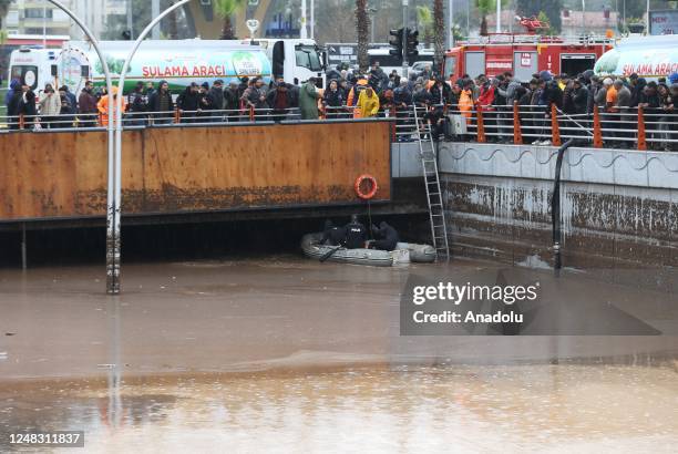Police divers, also known as frogmen, of Turkish Police Department conduct search and rescue operations at the flooded crossroads after downpour hit...