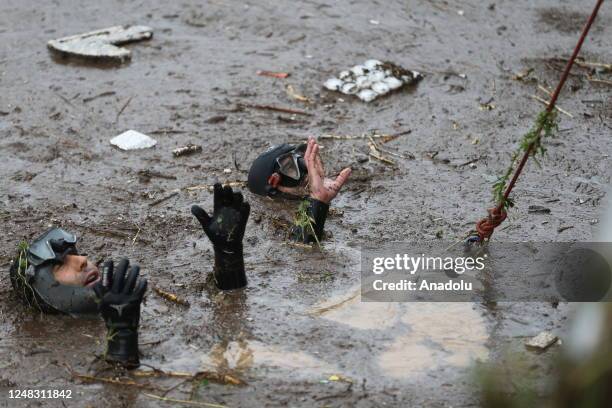 Police divers, also known as frogmen, of Turkish Police Department conduct search and rescue operations at the flooded crossroads after downpour hit...