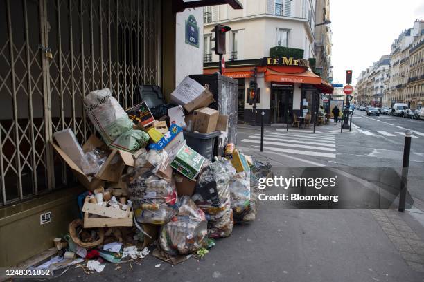 Piled up bags and boxes of trash left on the street in the 8th arrondissement of Paris, France, on Wednesday, Feb. 15, 2023. In some French cities...