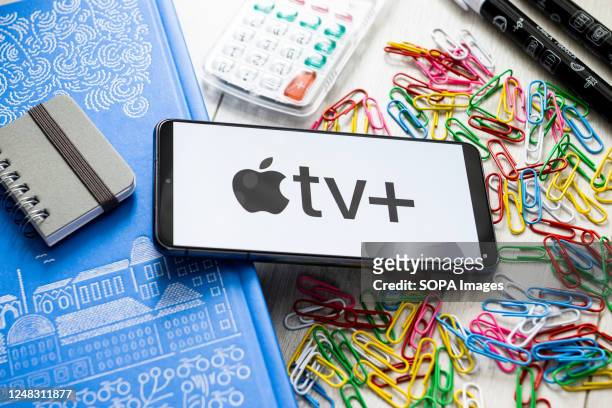 In this photo illustration Apple TV + logo seen displayed on a smartphone.