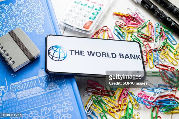 In this photo illustration The World Bank logo seen displayed on a smartphone.
