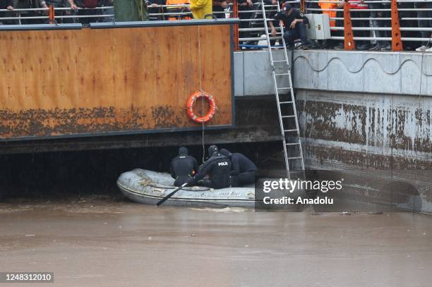 Police divers, also known as frogmen, of Turkish Police Department conduct search and rescue operations at the flooded crossroads after downpour hit...