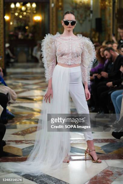 Model showcases creations by Lucia Cano during the Atelier Couture bridal catwalk within Madrid Fashion Week, at Santa Isabel Palace in Madrid.