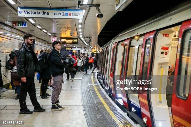 Commuters use the London Underground tube train.