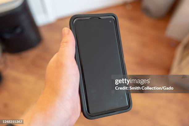 Hand of a man holding a Samsung Galaxy S10 smart phone, San Ramon, California, June 5, 2020.