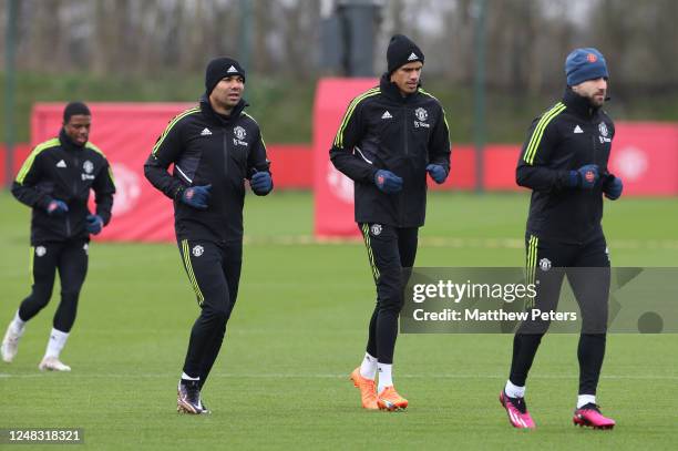 Casemiro & Raphael Varane of Manchester United in action during a Manchester United first team training session at Carrington Training Ground ahead...