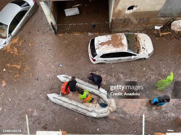 Police divers, also known as frogmen, of Turkish Police Department conduct search and rescue operations at the flooded crossroads after downpour hit...