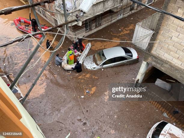 Police divers, also known as frogmen, of Turkish Police Department conduct search and rescue operations at the flooded crossroads after downpour hit...