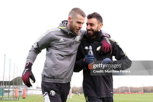 David De Gea & Bruno Fernandes of Manchester United walk out to a Manchester United first team training session at Carrington Training Ground ahead...