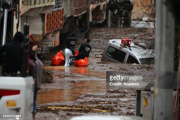 Civilians are being evacuated with boats from Akabe neighbourhood due to flash floods in Sanliurfa, Turkiye on March 15, 2023.