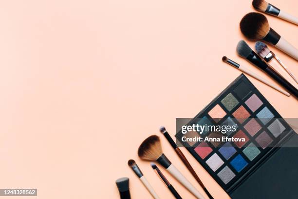 composition of eyeshadows palette and makeup brushes - paintbrush palette stock pictures, royalty-free photos & images