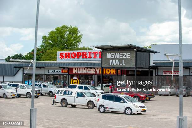 Cars parked in the parking lot of the Ngweze Mall, a shopping center on Katima Mulilo's main street.