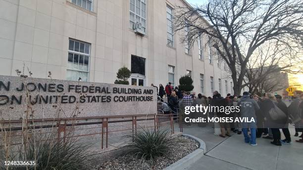 People wait in line to enter the J Marvin Jones Federal Building and Courthouse in Amarillo, Texas, on March 15, 2023. - US abortion opponents are...