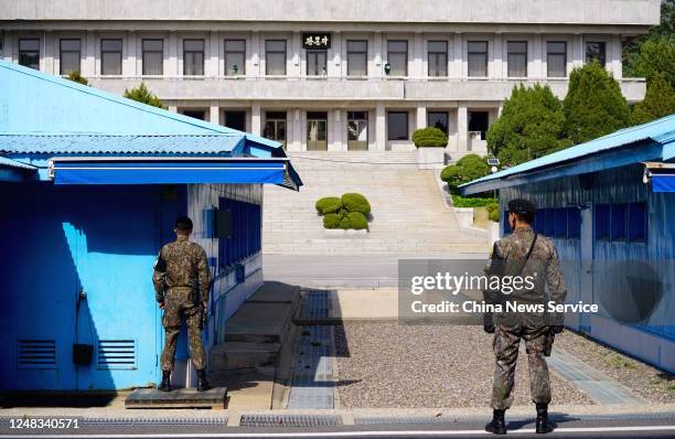 South Korean soldiers stand guard at the border truce village on April 18, 2018 in Panmunjom, South Korea.