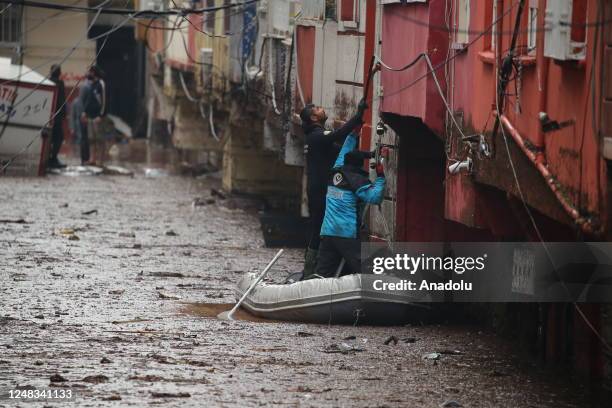 Teams work on the flooded street in Akabe neighborhood, due to floods in Sanliurfa, Turkiye on March 15, 2023. Efforts are being made to evacuate...
