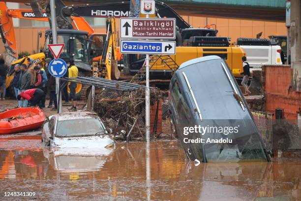 Some vehicles on the flooded street in Akabe neighborhood are submerged under water in Sanliurfa, Turkiye on March 15, 2023. Efforts are being made...