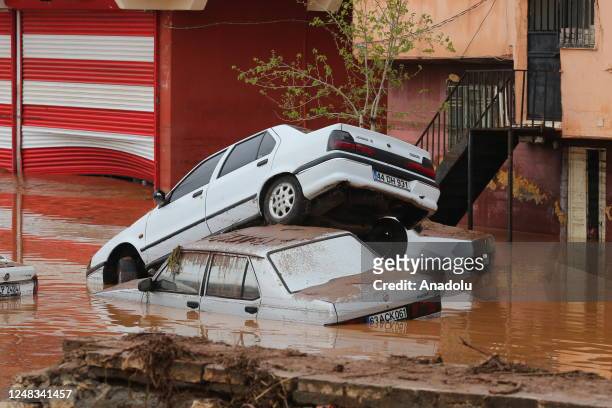 Some vehicles on the flooded street in Akabe neighborhood are submerged under water in Sanliurfa, Turkiye on March 15, 2023. Efforts are being made...