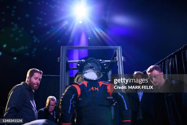 The new spacesuit is carried out during the Axiom Space Artemis III Lunar Spacesuit event at Space Center Houston in Houston, Texas, on March 15,...