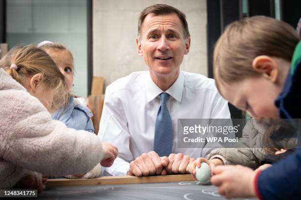 Chancellor of the Exchequer, Jeremy Hunt meets children during a visit to Busy Bees Battersea Nursery in south London, after delivering his Budget...