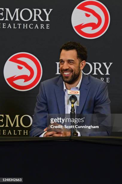 Landry Fields of the Atlanta Hawks introduce Quinn Snyder during a press conference on February 27, 2023 at State Farm Arena in Atlanta, Georgia....