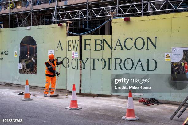 Misplaced doors on a construction site hoarding make spelling difficult at The Arc EC1 new residential apartment buildings under construction as part...