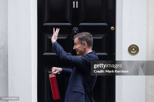 Jeremy Hunt, UK Chancellor of the Exchequer, leaves 11 Downing Street with the budget despatch box to present his Budget speech in the House of...