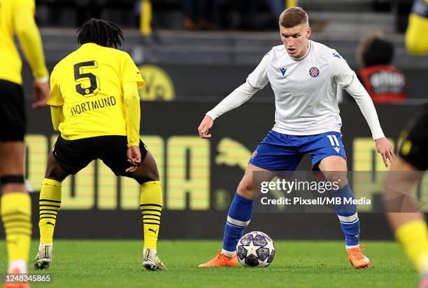Roko Brajkovic of Hajduk Split in action against Prince Aning of Borussia Dortmund during UEFA Youth League Quarter Final match between Borussia...