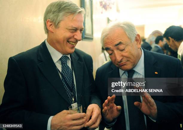 Director of International Monetary Fund Dominique Strauss Kahn and Christian Noyer, Governor of Bank of France attend a symposium commemorating the...