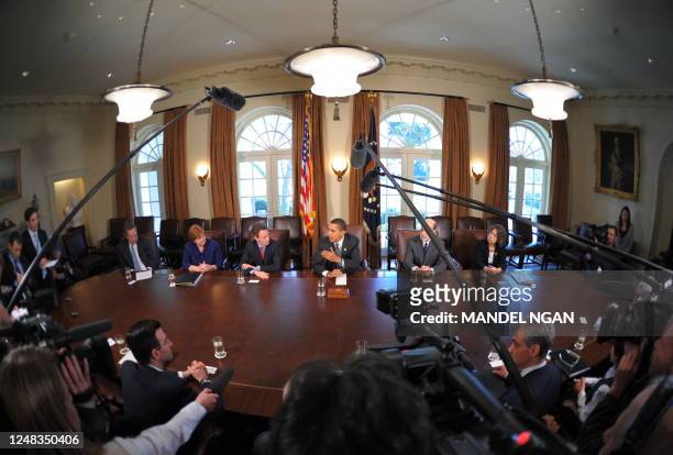President Barack Obama speaks during an economic daily meeting March 23, 2009 in the Cabinet Room of the White House in Washington, DC. L-R with the...