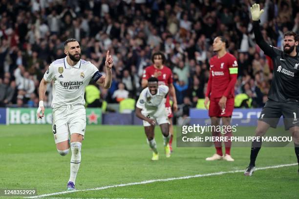 Real Madrid's French forward Karim Benzema celebrates scoring his team's first goal during the UEFA Champions League last 16 second leg football...