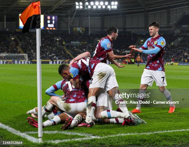 The Burnley team celebrate Nathan Tellas second goal during the Sky Bet Championship between Hull City and Burnley at MKM Stadium on March 15, 2023...