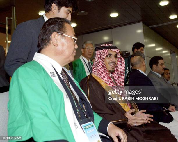 Mayor of the Japanese city of Chofu Yoshio Katsuyuki and Saudi prince Nawaf bin Faysal Bin Fahed , vice-chairman of the Saudi Youths committee, watch...