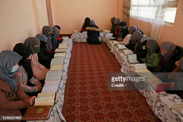 In this picture taken on February 13 Afghan girls learn the holy Koran at a madrassa or an Islamic school on the outskirts of Kabul. - Islamic...