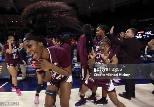 Denae Carter of the Mississippi State Bulldogs and Asianae Johnson of the Mississippi State Bulldogs celebrate their victory over the Illinois...