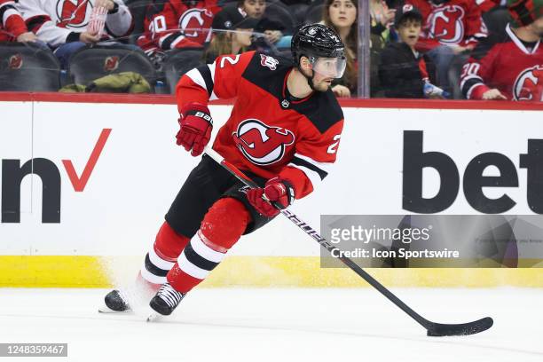 New Jersey Devils defenseman Brendan Smith skates with the puck during the National Hockey League game between the Tampa Bay Lightning and the New...
