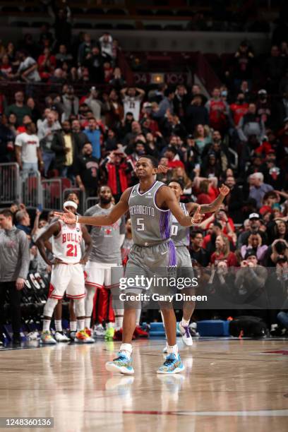 De'Aaron Fox of the Sacramento Kings celebrates scoring a three point basket to win the game against the Chicago Bulls on March 15, 2023 at United...