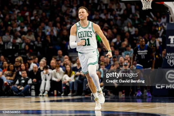 Blake Griffin of the Boston Celtics celebrates his dunk in the third quarter of the game against the Minnesota Timberwolves at Target Center on March...