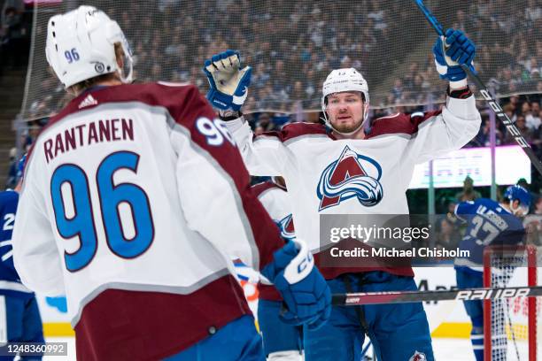 Valeri Nichushkin of the Colorado Avalanche celebrates a goal with teammate Mikko Rantanen at the Scotiabank Arena on March 15, 2023 in Toronto,...