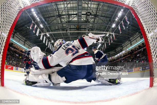 Goaltender Tristan Lennox of the Saginaw Spirit makes a glove save during the game against the Windsor Spitfires at WFCU Centre on March 15, 2023 in...