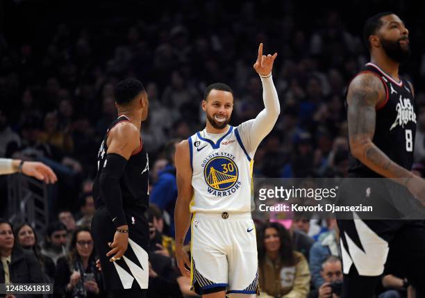 Stephen Curry of the Golden State Warriors celebrates after scoring a basket against the Los Angeles Clippers during the first half of the game at...